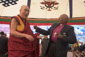 The Dalai Lama and Desmond Tutu dancing